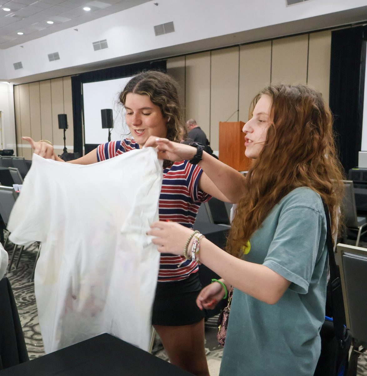 Alexander W. Dreyfoos School of the Arts senior Emmy Mason and junior Sara Lipnitzky imagine possible designs for their T-shirt.
