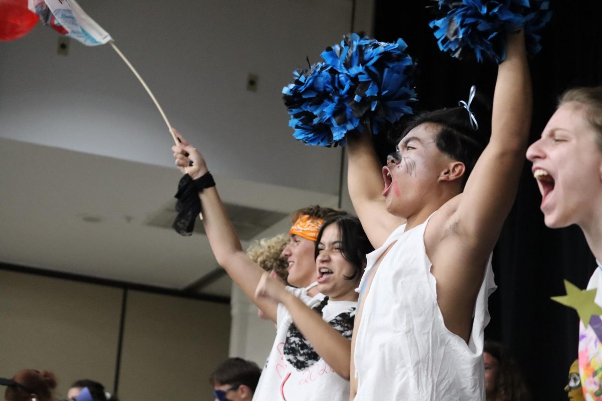 We Got Spirit- Screaming to the crowd, Long Truong, hypes up his staff in the crowd. Truong was dressed as his school's husky mascot and howled down the runway.